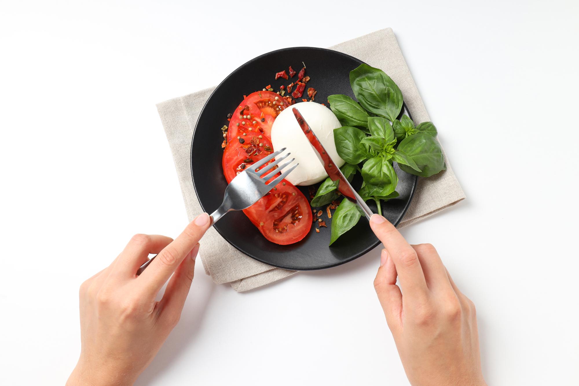 Hands plating a dish during a private lesson