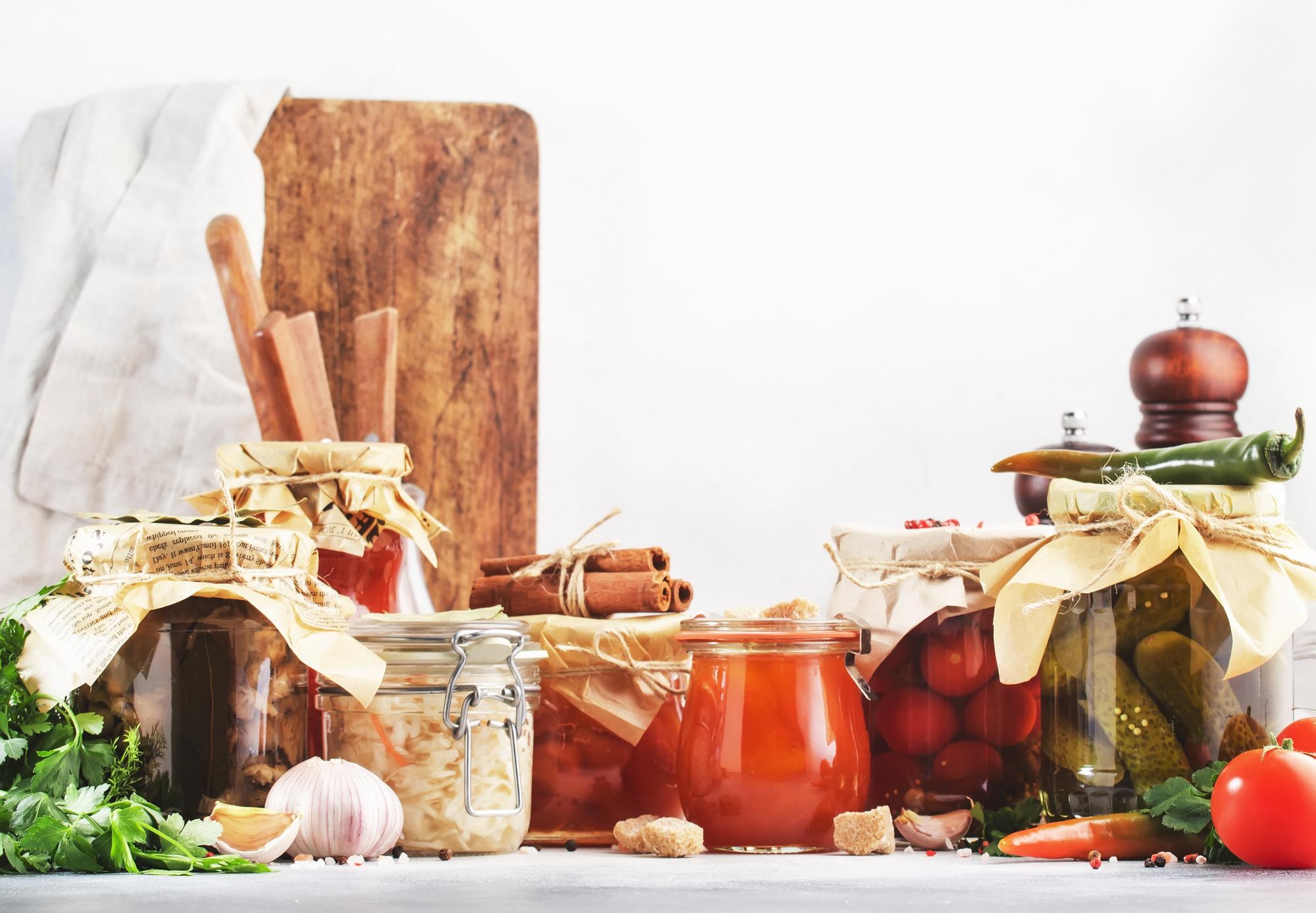 Small-batch preserves in jars on wooden table